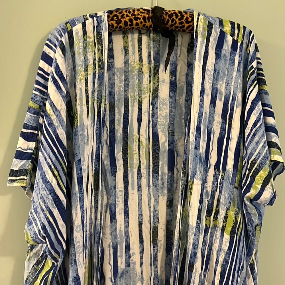 Small bathing suit cover or any cover up. Blue green white with frilys at bottom